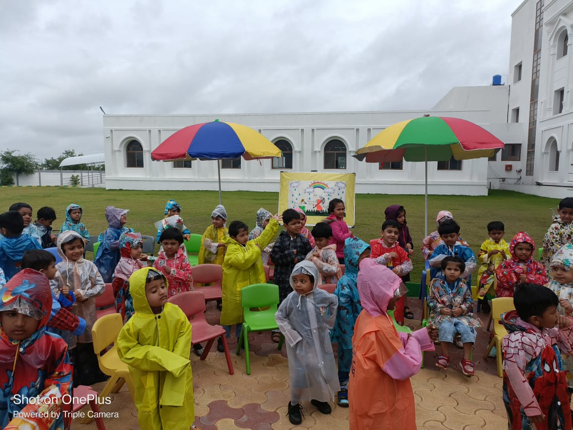 Pre Primary Students enjoying Monsoon day